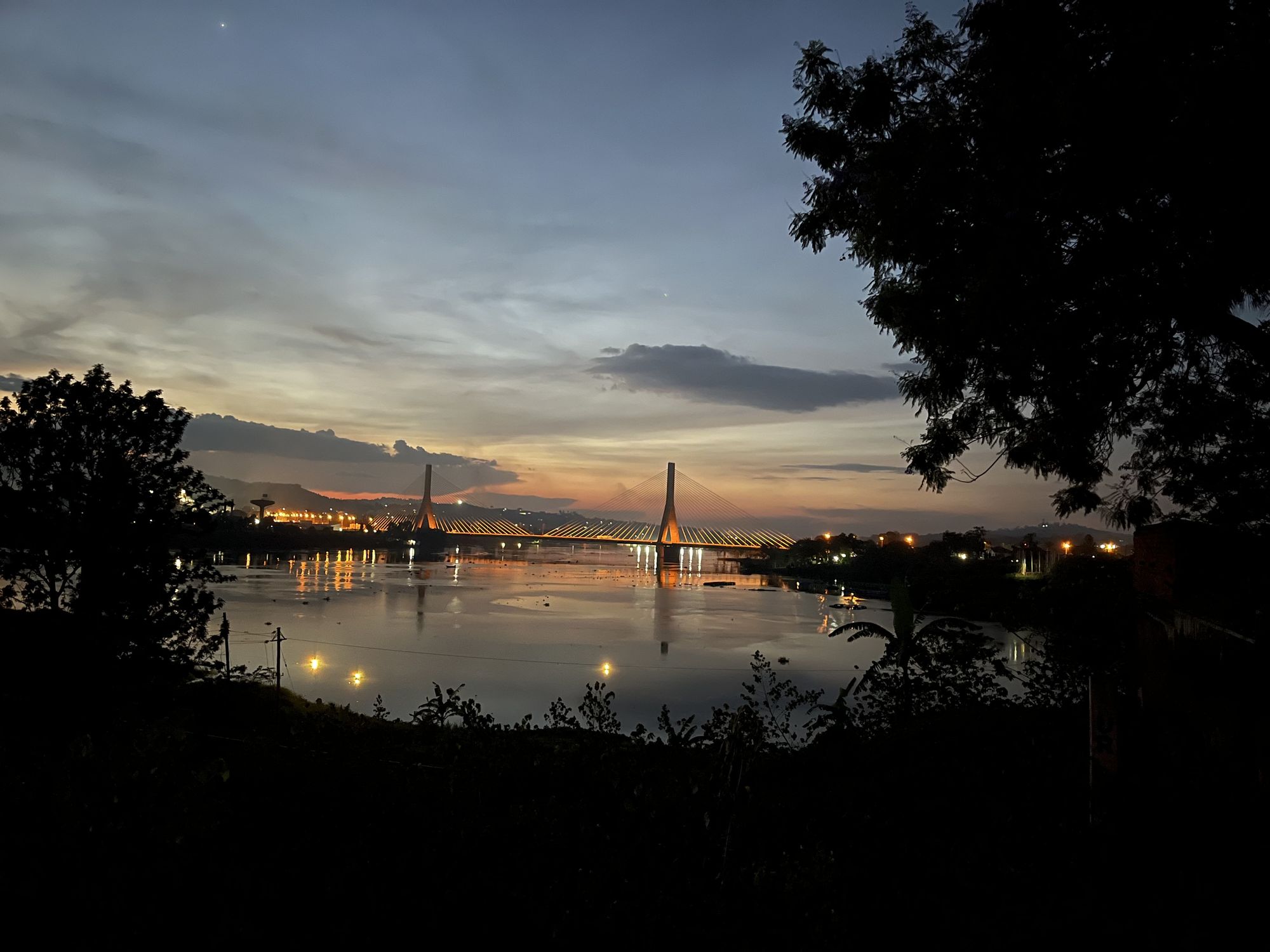 The River Nile at dusk from Hotel Paradise, with the Source of the Nile Bridge lit up