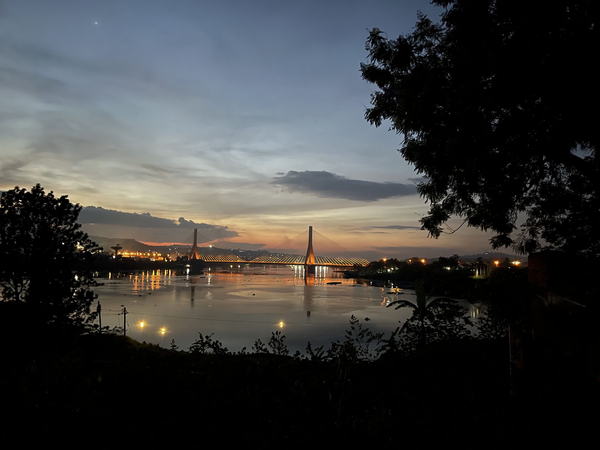 Evening view across the River Nile to the Source of the Nile Bridge